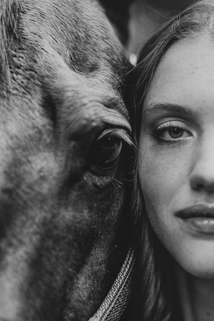 A closeup picture of a girl and her horse