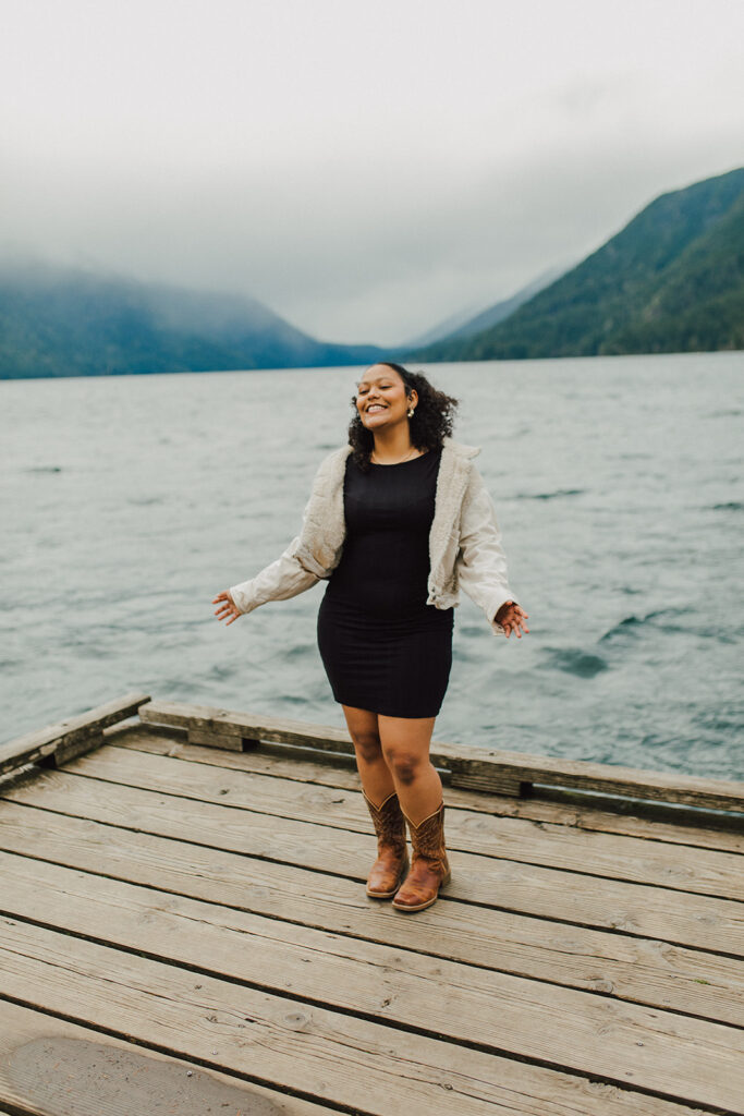 Girl standing on a dock on Lake Crescent