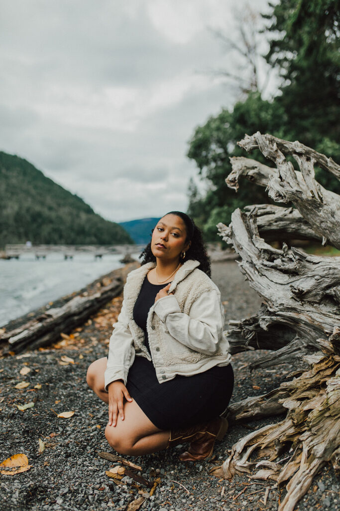Girl sitting by Lake Crescent